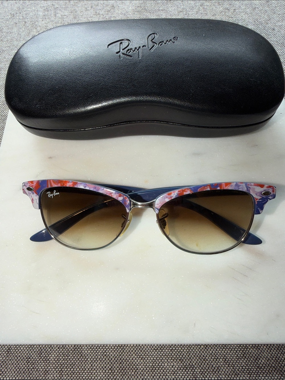 Ray -Ban women’s sun glasses.